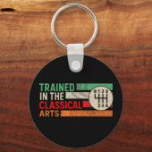 Opgeleid in de klassieke kunst Handleiding Transmi Sleutelhanger (Voorkant)