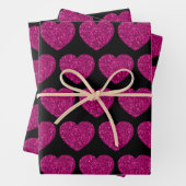 Opperste roze hartritme glitter sparkeert zwart pa inpakpapier vel (In situ)