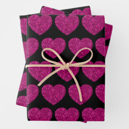 Opperste roze hartritme glitter sparkeert zwart pa inpakpapier vel