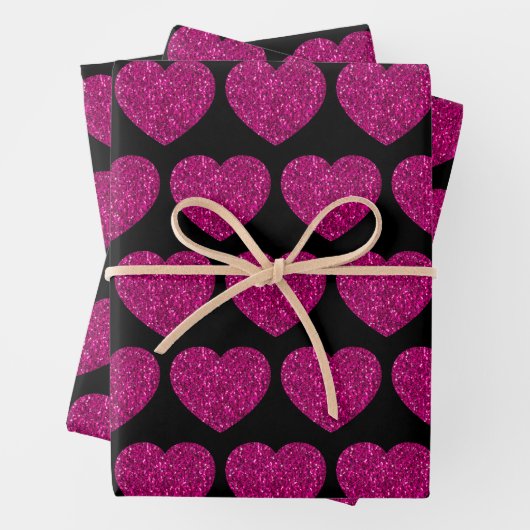 Opperste roze hartritme glitter sparkeert zwart pa inpakpapier vel (In situ)