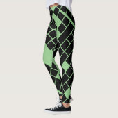 Opvallende zwarte rechthoeken op groene Leggings (Links)