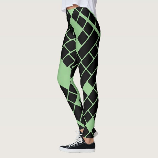 Opvallende zwarte rechthoeken op groene Leggings (Links)