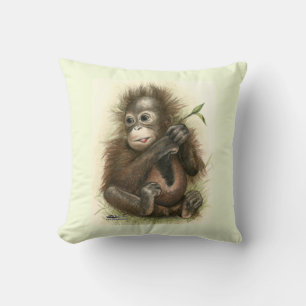 Orang-oetanbaby met bladeren kussen