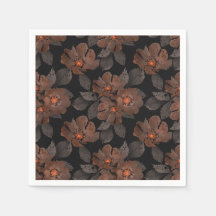 Orange and brown flowers on a black background.