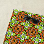 Orange, green and blue patterned  strandlaken (In situ)