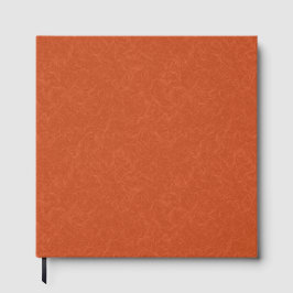 Orange textured surface with swirling pattern gastenboek