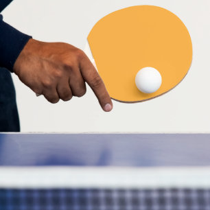 Oranje achtergrondstructuur gedempt voor web en af tafeltennisbatje