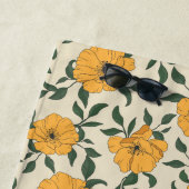 Oranje bladerbloempatroon strandlaken (In situ)