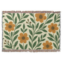 Oranje bloemen en groene bladeren gooien deken