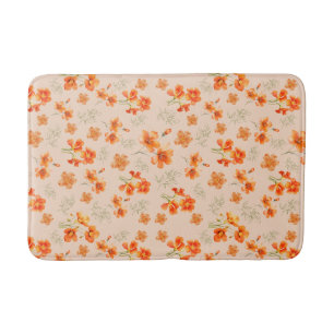 Oranje bloemen met groene bladeren badmat