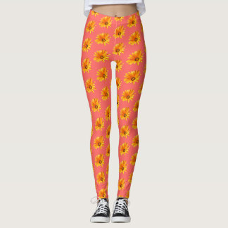 Oranje Cape Daisy tegen Living Coral Background Leggings