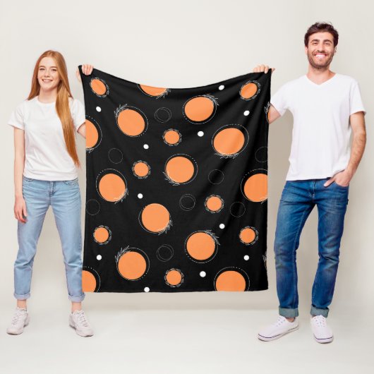 Oranje cirkels en zwarte achtergrond fleece deken (In situ)