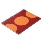 Oranje cirkels op rood notitieboek (Linkerzijde)