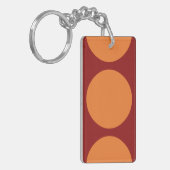 Oranje cirkels op rood sleutelhanger (Voorkant Links)