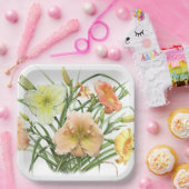 Oranje dagbladen over botanisch ontwerp papieren bordje (Feest)