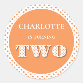 Oranje draaien van twee pokadots ronde sticker