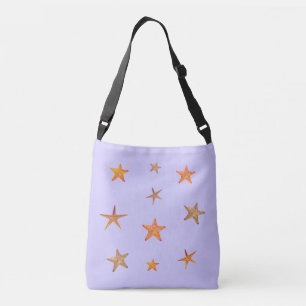 Oranje en beige zeesterren op lichtblauw crossbody tas