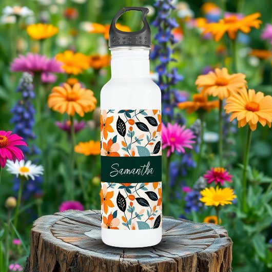 Oranje en blauw gebladerte en bloemen gepersonalis waterfles