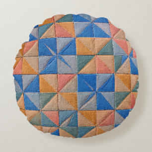 oranje en blauwe quilt rond kussen
