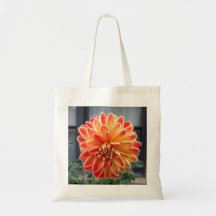 Oranje en gele dahlia op een canvas tas