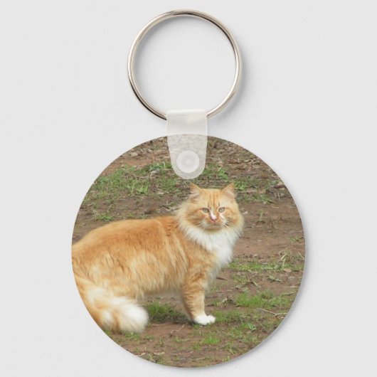Oranje en witte drijfmest sleutelhanger (Voorkant)