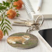 Oranje en witte drijfmest sleutelhanger (Zijkant)