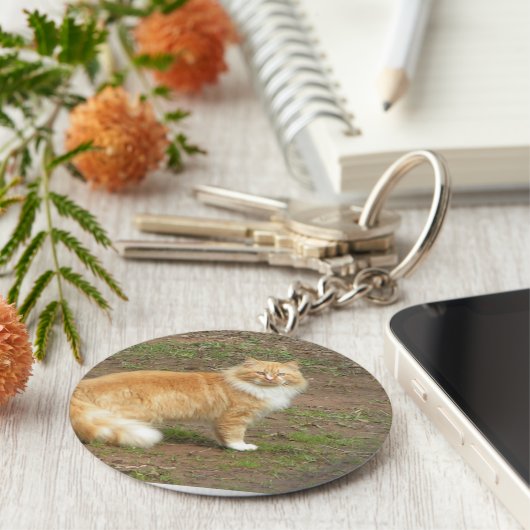 Oranje en witte drijfmest sleutelhanger (Zijkant)