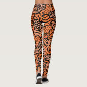 Oranje en zwarte meisjesachtige dierenprint harten leggings (Achterkant)