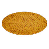 Oranje gebreide trui, gestructureerde achtergrond. snijplank (Hoek)