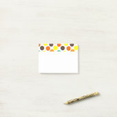 Oranje, gele, bruine, blauwe Stippen Post-it® Notes (Op bureau)