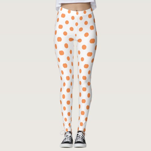 Oranje gestippeld ontwerp leggings (Voorkant)