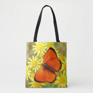 Oranje gevleugelde vlinder en bloemen tote bag