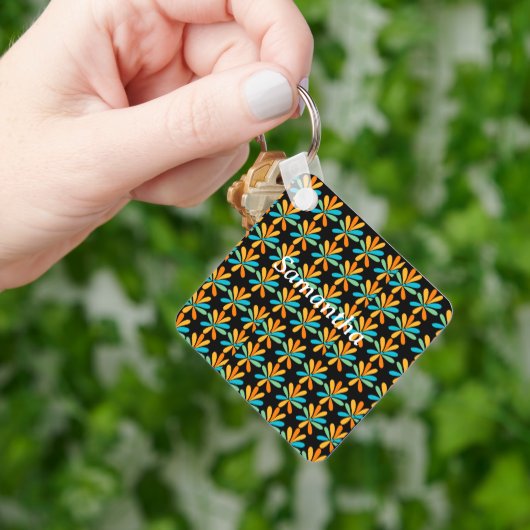 Oranje, groene en blauwe bloemen sleutelhanger (Hand)