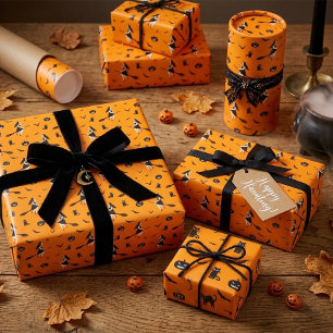 Oranje Halloween inpakpapier met heksen