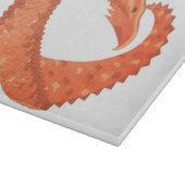 Oranje hartdraak op wit snijplank (Hoek)