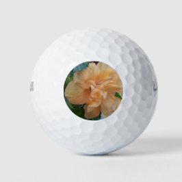 Oranje hibiscus bloem op een golfbal golfballen
