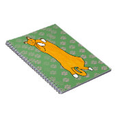 Oranje kat ligt op zijn rug notitieboek (Rechterzijde)