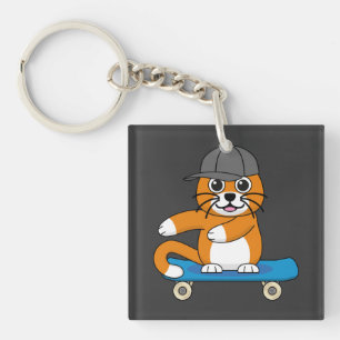 Oranje kat op de Cartoon van het skateboard Sleutelhanger