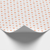 Oranje kerstrecorder met een springplank cadeaupapier (Hoek)