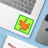 Oranje kikkervisje sticker (Laptop met iPhone)