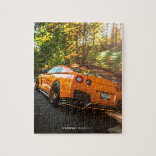 Oranje Nissan GT-R die door de straten van Seattle Legpuzzel