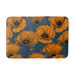 Oranje papaver op donkerblauw badmat