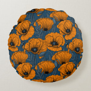 Oranje papaver op donkerblauw rond kussen