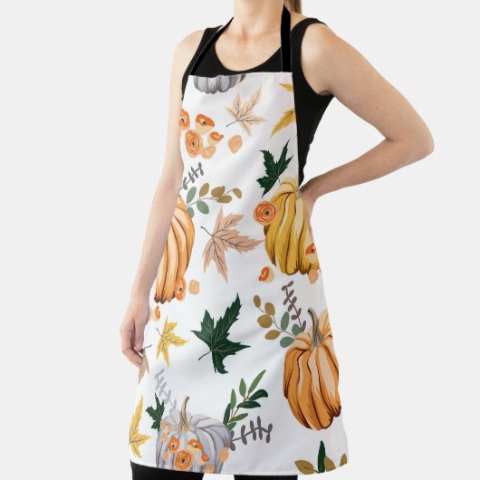 Oranje pompoen en bloemen in het najaar schort (Insitu)