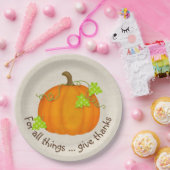 Oranje pompoen op schoot papieren bordje (Feest)