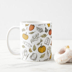 Oranje pompoenen en gegraveerde bladeren.   koffiemok