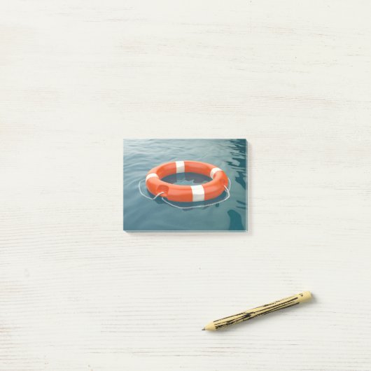 Oranje reddingsboei in de oceaan post-it® notes (Op bureau)