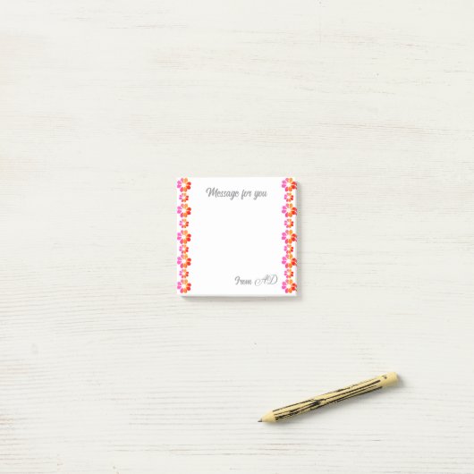 Oranje rode bloem post-it® notes (Op bureau)