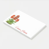 Oranje rode orchidee bloem na het opschrift post-it® notes (Schuin)