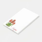 Oranje rode orchidee bloem na het opschrift post-it® notes (Schuin)